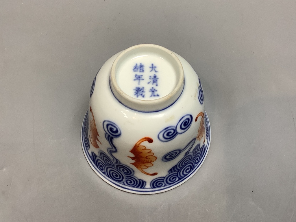 A Chinese underglaze blue and iron red 'bat' cup, height 6cm